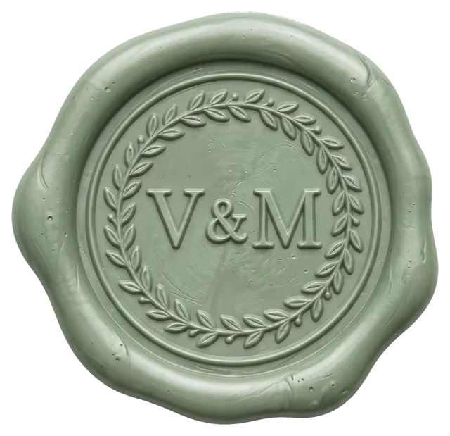 Sello de cera verde con las iniciales V & M